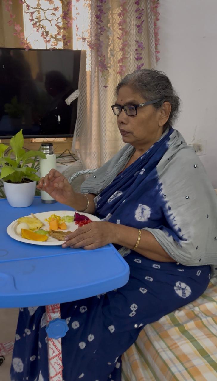 A resident enjoying her meal at Priyanka Old Age Home