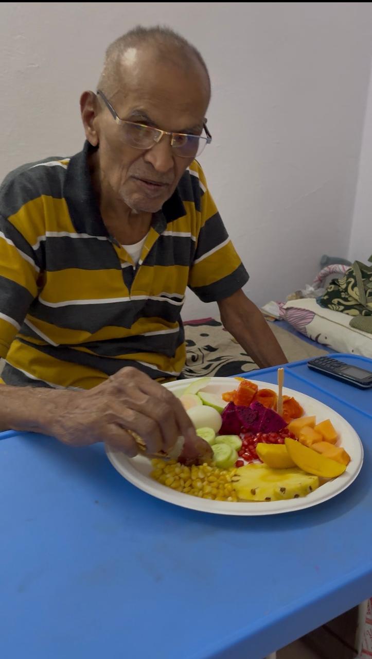 A resident enjoying a nutritious meal at Priyanka Old Age Home