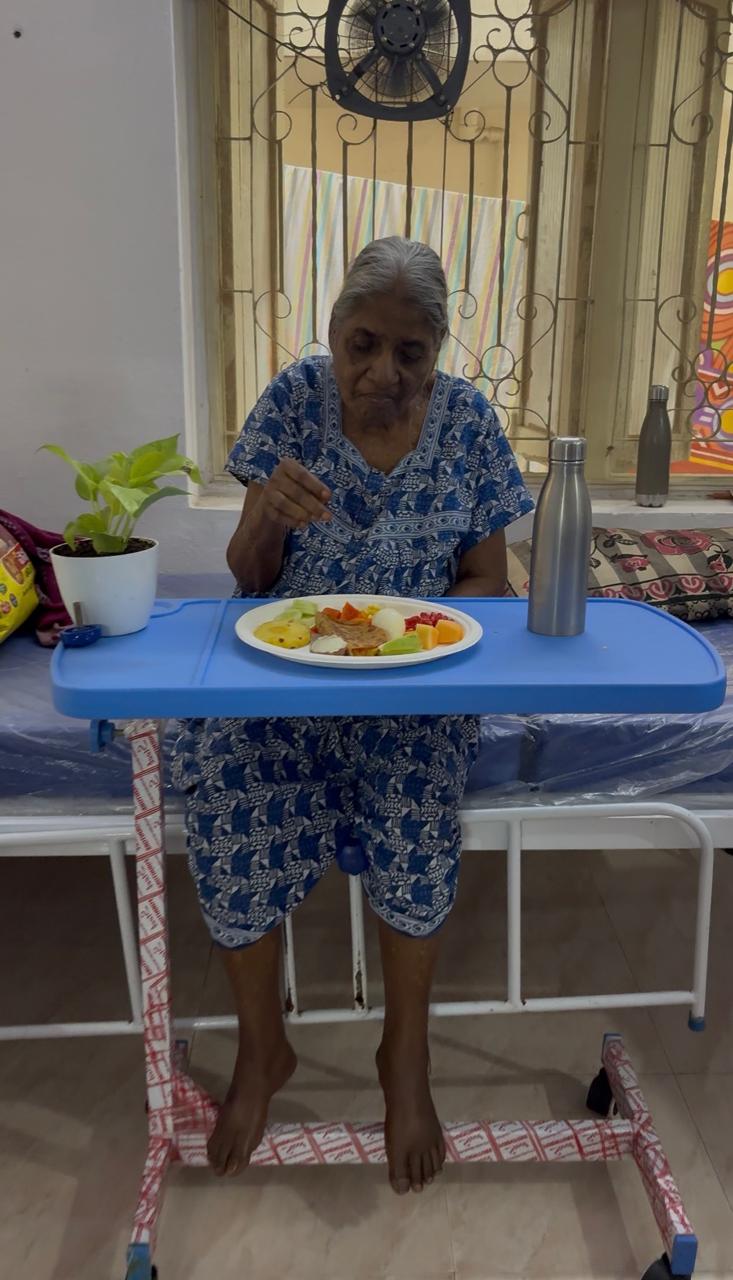 An elderly woman enjoying a nutritious meal